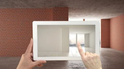 Augmented reality concept. Hand holding tablet with AR application used to si Illustrazione stock