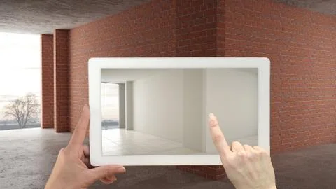 Augmented reality concept. Hand holding tablet with AR application used to si Illustrazione stock