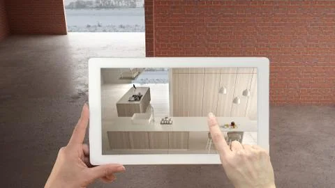 Augmented reality concept. Hand holding tablet with AR application used to si Illustrazione stock
