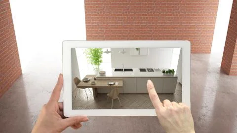 Augmented reality concept. Hand holding tablet with AR application used to si Illustrazione stock