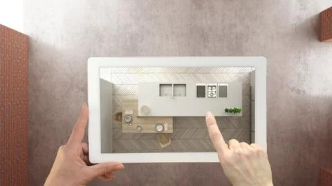 Augmented reality concept. Hand holding tablet with AR application used to si Illustrazione stock