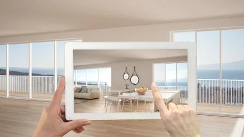 Augmented reality concept. Hand holding tablet with AR application used to si Stock Illustration