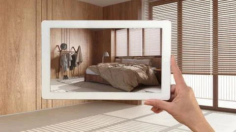 Augmented reality concept. Hand holding tablet with AR application used to .. Stock Illustration