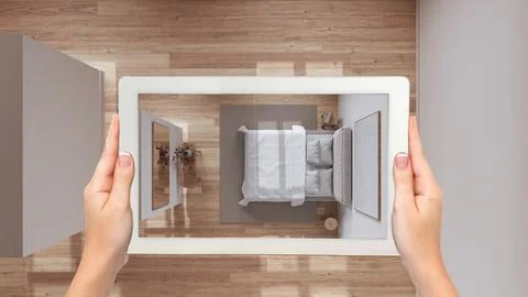 Augmented reality concept. Hand holding tablet with AR application used to .. Stock Illustration
