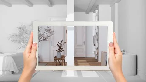 Augmented reality concept. Hand holding tablet with AR application used to .. Stock Illustration