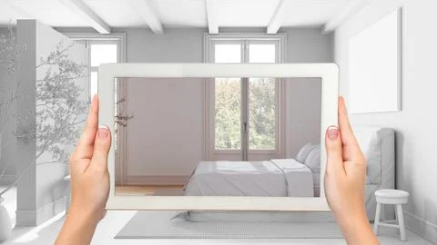 Augmented reality concept. Hand holding tablet with AR application used to .. Stock Illustration