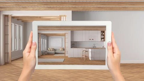 Augmented reality concept. Hand holding tablet with AR application used to .. Stock Photos