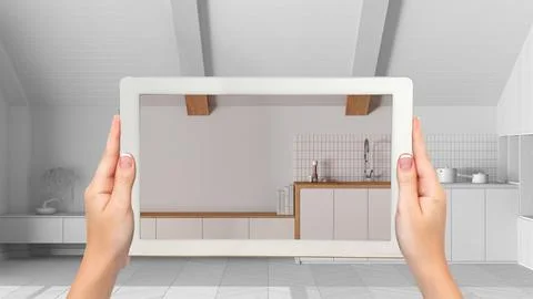 Augmented reality concept. Hand holding tablet with AR application used to .. Stock Photos