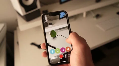 Augmented Reality Game App Showing a Virtual Game on Smartphone Stock-Footage 168537649