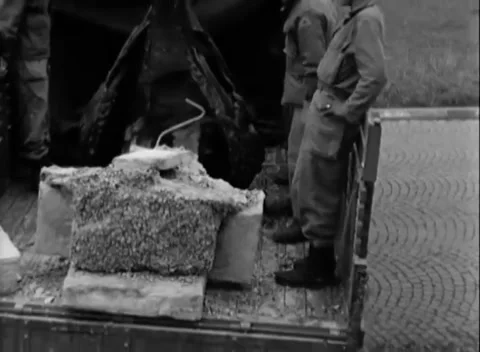 AUGSBURG - 1945: Monument debris - Eagle and rubble fill truck bed Stock Footage 344495783