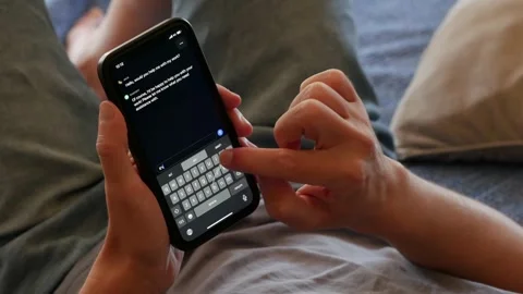 AUGUST 11, 2023: Using OpenAI ChatGPT App on an iPhone Stock Footage 249321210