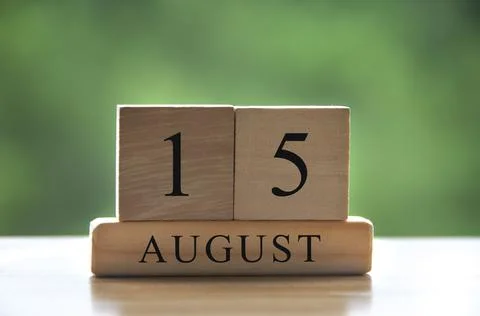 August 15 calendar date text on wooden blocks with blurred background park. Stock Photos