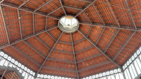August 19, 2025 - Barcelona, Spain - El Born market interior metal frame ceiling Stock Footage 338032029