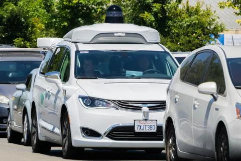 August 6, 2017 Mountain View/Ca/USA - Waymo self driving car cruising on a st Stock Photos