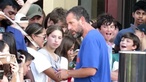 August 6, 2026, Madison, NJ: Comedian and actor Adam Sandler signs autographs Stock Footage 341747710