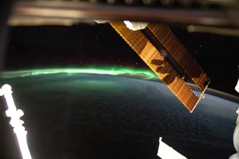 Aurora Australis over a Cloudy Ocean from the International Space Station Stock Footage 261678413