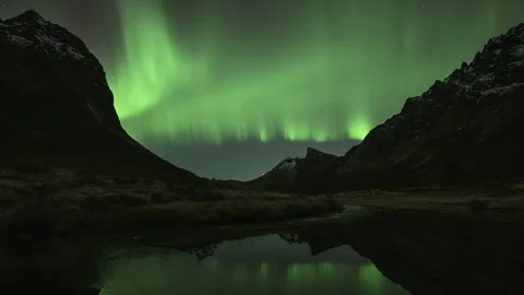 Aurora Borealis between mountain peaks Stock Footage 266922424