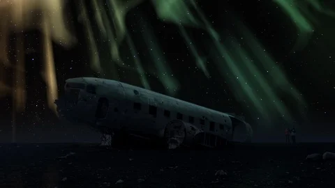Aurora borealis crashed DC-3 Plane Solheimasandur winter sky tourism night Stock Footage 88165030