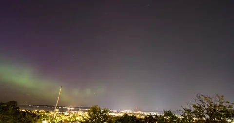 Aurora Borealis dancing across the night sky above the city of Jonkoping, Sweden Video stock 282798828