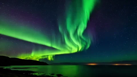 Aurora borealis dancing in the arctic night sky 스톡 동영상 307428111