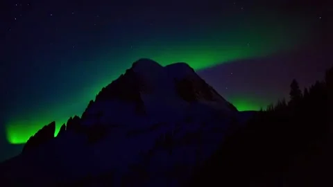 Aurora Borealis Dancing over Snow-Covered Mountain - Time-Lapse Video stock 285836968