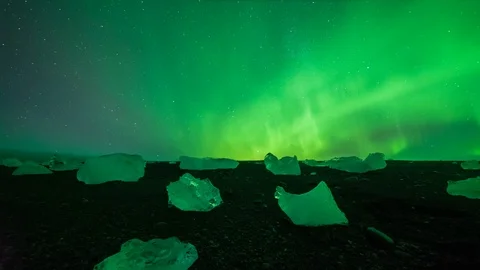 Aurora Borealis Hyperlapse Over Small Icebergs on Diamond Beach Stock Footage 126198946