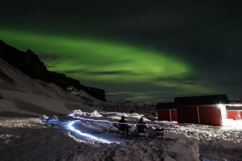 Aurora Borealis in with light effects, people sight seeing Aurora lights Stock Photos