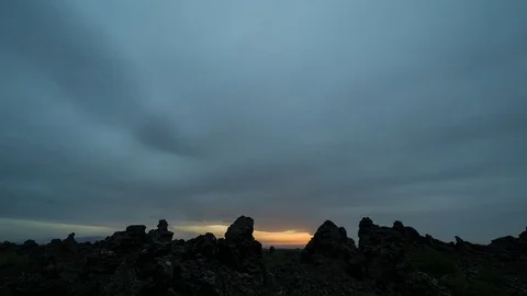Aurora borealis moving over rock formations at evening Stock Footage 73010743
