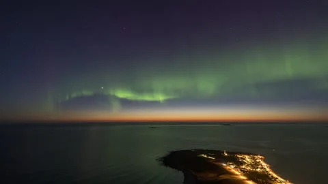Aurora Borealis over the coast with a lighthouse Stock Footage 251364342