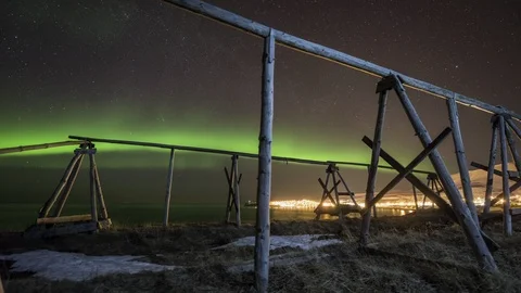 Aurora Borealis over fish flake near Husavik Stock Footage 86347840