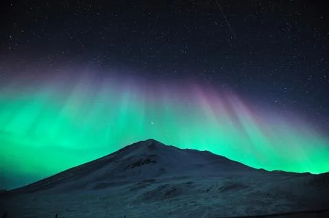 Aurora borealis over mountain Stock Photos