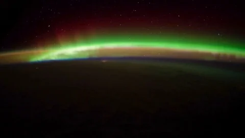 Aurora Borealis over the Pacific Ocean at night from space in 4K. Stock Footage 74285631