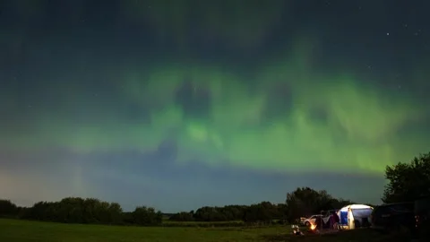 Aurora borealis. Time lapse footage of the night sky and northern lights over a Stock Footage 249738087