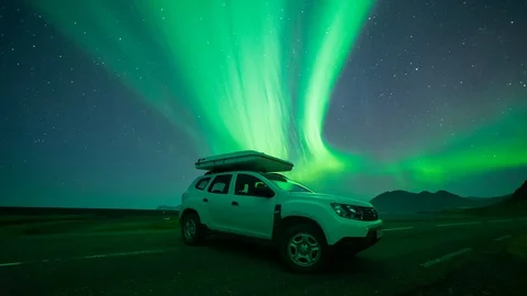 Aurora Borealis Time Lapse Over an SUV Stock Footage 126198892