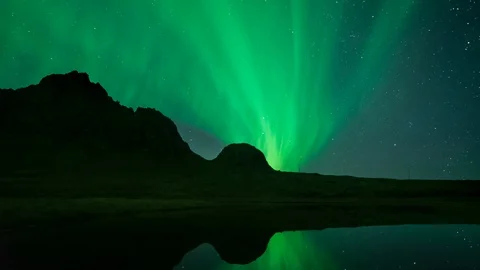 Aurora Borealis Time Lapse Over a Reflective Lake Stock Footage 126198893