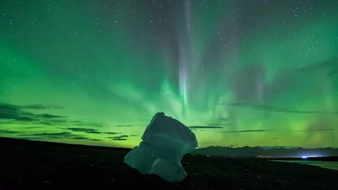 Aurora Borealis Time Lapse Over a Single Iceberg on Diamond Beach Stock Footage 126198906