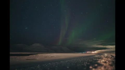 Aurora borealis timelapse over snowy arctic fjord in Longyearbyen, Svalbard Stock Footage 301566323