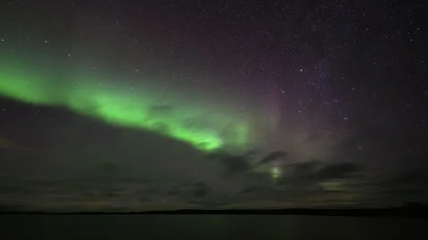 The aurora hides behind the clouds Stock Footage 250286452