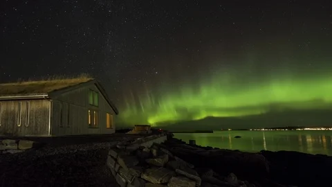 Aurora over the cabin in the coast Stock Footage 123008976