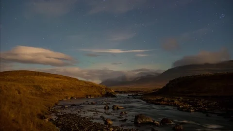 Aurora starting to move over the sky of iceland and a river landscape Stock Footage 120947686