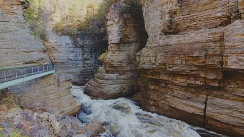 Ausable River flowing through narrow gorge between walls of Potsdam Sandstone, A Stock Footage 304247307