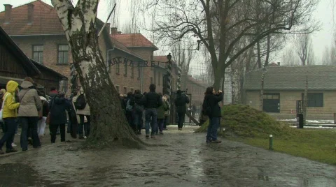 Auschwitz 1 Tourists file inside Stock Footage
