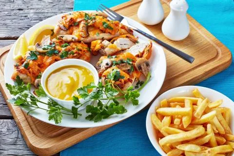Aussie Chicken breasts topped with melted cheese Stock Photos