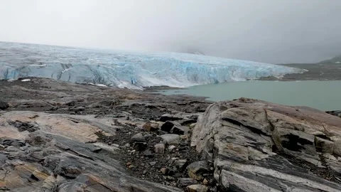 Austdalsbreen glacier front over Styggevatnet lake in Jostedal, Norway Stock Footage 329753769