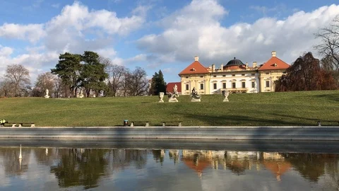Austerlitz castle and pool in autumn, view from back garden Stock Footage 98420376