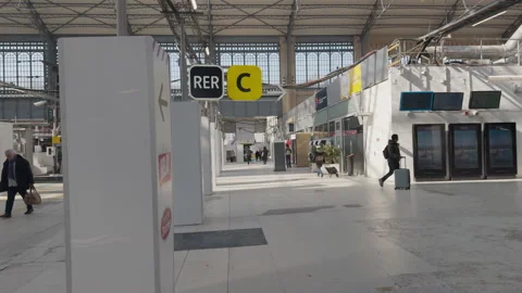 Austerlitz Station in Paris shows modern updates as travelers move through Stock Footage 306574047
