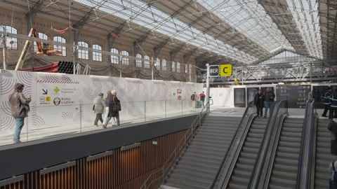 Austerlitz train station in Paris with people passing during final restoration Stock Footage 306574669