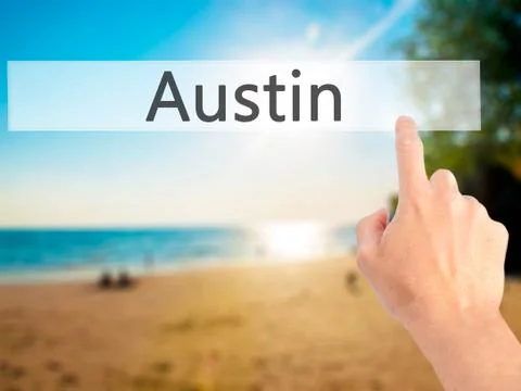 Austin - Hand pressing a button on blurred background concept on visual scree Stock-Fotos