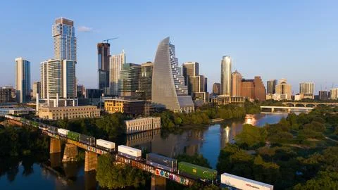 Austin Skyline with Train Going Through City 2023 Golden Hour Skyline Stock Photos