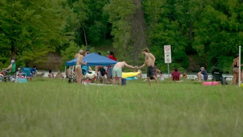 Austin, Texas - 9/2/2018: Labor Day sun lovers and their dogs at Lake Travis Stock Footage 98043705
